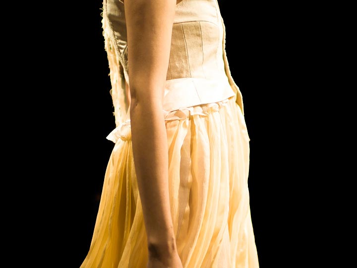 Close up photo of a beautiful pale yellow dress by Junya Tashiro spring 2012 collection at tokyo fashion week photograph by Danny Roberts