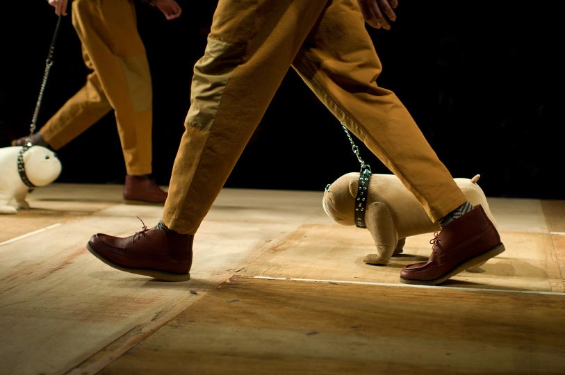 Photo from Photographer Danny Roberts of two peoples feet walking stuffed dogs during Ne-nets show during Tokyo Fashion Week spring 2012