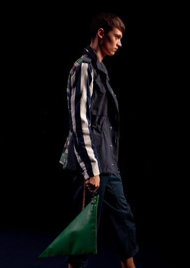 Photo from Photographer Danny Roberts of a standing Profile of Male model in a blue jacket walking in Phenomenon Fashion show at Tokyo Fashion Week Spring 2012