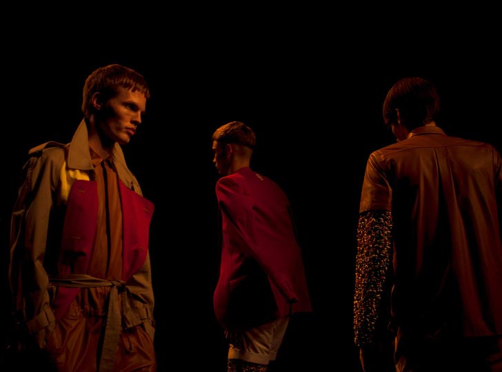 Horizontal Photo of 3 Male Models in bright clothes walking down the runway in Phenomenon spring 2012 collection for Tokyo Japan Fashion week by danny roberts