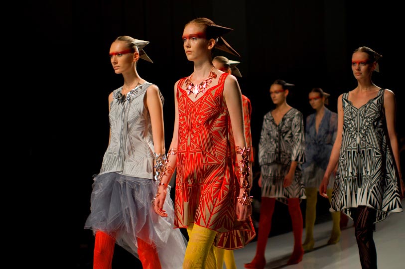 A horizontal picture of models with cone like hair runday during Somarta show at Tokyo Fashion Week spring 2012 Photo by Artist Danny Roberts