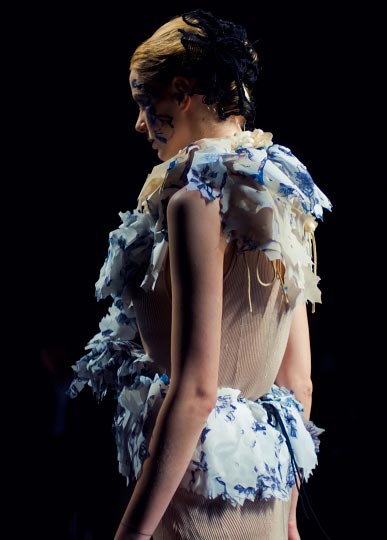 Artist Danny Roberts profile Picture of a female model in a pretty white and blue frill dress in Yasutoshi Exumi spring 2012 collection at tokyo fashion week